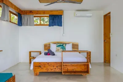a bedroom with a bed in a room at Ocean View Bungalows in Pital