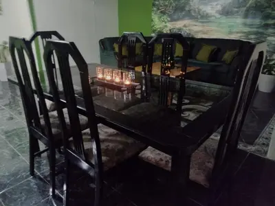 a dining room table and chairs with candles on it at Casa Rincón del Monte in Monteverde Costa Rica