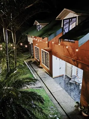 a house with lights on the side of it at Casa Rincón del Monte in Monteverde Costa Rica