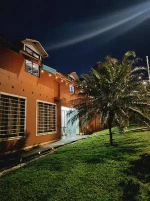 a palm tree in front of a building at Casa Rincón del Monte in Monteverde Costa Rica