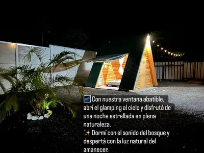 a sign in front of a building with a tent at Eco Glamping Verde, Bahia Gigante in Puntarenas