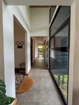 a hallway of a house with a glass extension at Casa Micelio in Monteverde Costa Rica