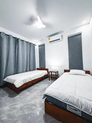a bedroom with two beds and a ceiling at Blue Banana Villas in San José Pinilla