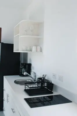 a kitchen with a sink and a counter top at Blue Banana Villas in San José Pinilla