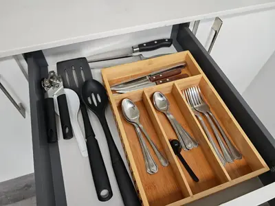 a drawer filled with silver utensils in a kitchen at 2811 SECRT Sabana Hermoso Estudio in San José