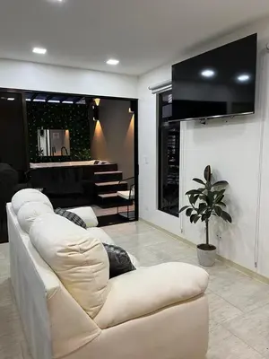 a living room with a white couch and a table at Los Ángeles in Fortuna