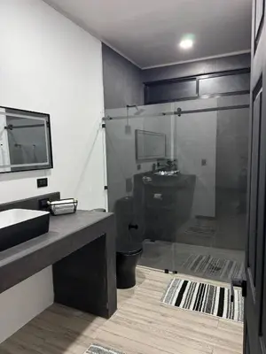 a bathroom with a shower and a sink and a toilet at Seven Paradise - Your personal rainforest in Fortuna