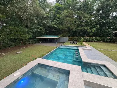 an overhead view of a swimming pool in a yard at Seven Paradise - Your personal rainforest in Fortuna