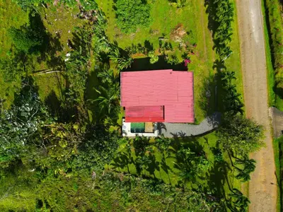 an overhead view of a red building in a field at Famillies Getaway - 3Bed & 2Bath in Arenal Volcano in Fortuna