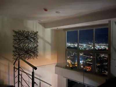 a room with a window with a city view at Exclusive apartment in downtown Costa Rica in San José