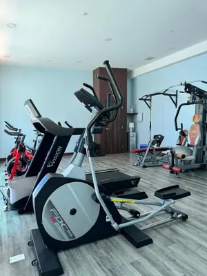 a gym with several exercise bikes in a room at Exclusive apartment in downtown Costa Rica in San José