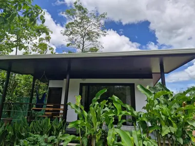 a house with a black roof at Pantala Villa in Fortuna