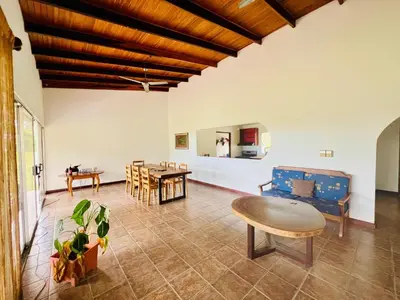 a living room with a couch and a table at Casa Las Brisas del Miravalles in Bagaces