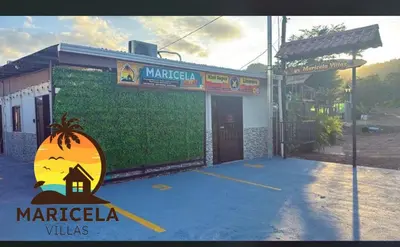 a building with a sign in front of it at Villas Maricela Guanacaste in Chorro