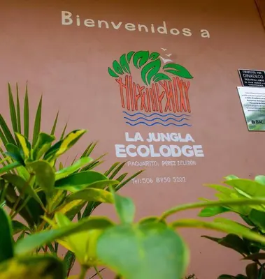 a sign for a restaurant with a pineapple on it at La jungla ecolodge in San Juan