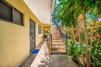 a stairway leading up to a house with a door at Sweet Dreams #49 Playa Ocotal in Coco