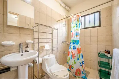 a bathroom with a sink and a toilet and a shower at Sweet Dreams #49 Playa Ocotal in Coco