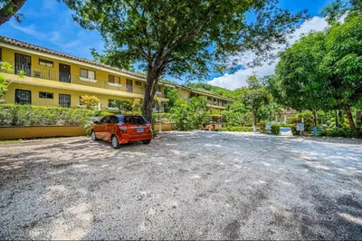 an orange car parked in front of a building at Sweet Dreams #5 Playa Ocotal in Coco