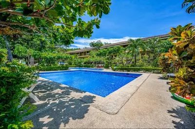 a swimming pool in the backyard of a house at Sweet Dreams #5 Playa Ocotal in Coco