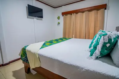 a bedroom with a bed and a television in it at Rustic Ranch in Fortuna