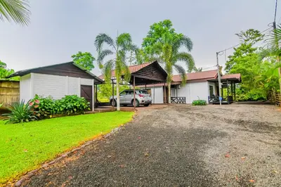 a house with a car parked in the driveway at Rustic Ranch in Fortuna
