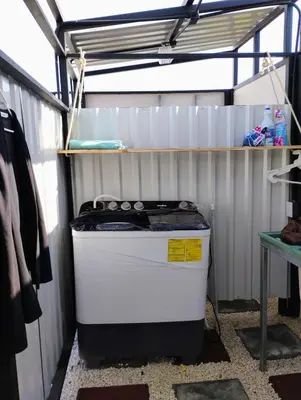 a cooler sitting in a garage with a shelf at A-frame cabin in Palma