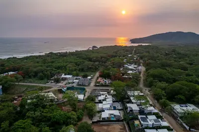 an aerial view of a town next to the ocean at Waterfall Pool, Kids' Paradise, Quiet Beaches in Playa Grande