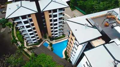 an overhead view of a building with a swimming pool at Luxury Suite Torres Del Mar Jacó in Jacó