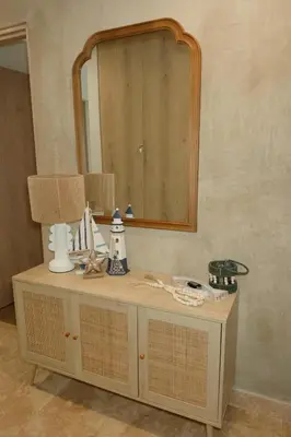 a bathroom counter with a mirror and a sink at Luxury Suite Torres Del Mar Jacó in Jacó