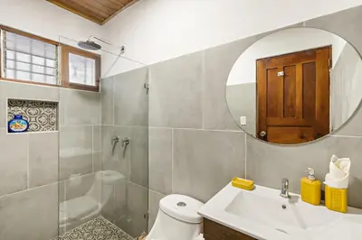 a bathroom with a sink and a mirror at VBM6 Delightful Beachside Cottage Close to Beach in Tamarindo