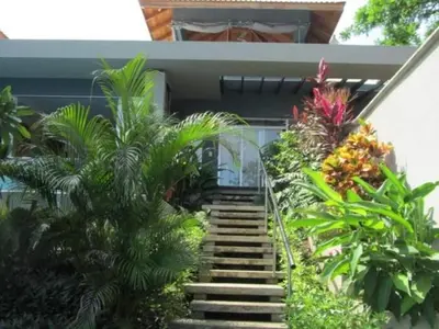 a staircase leading up to a house with plants at Casa Candelitas Private Yoga ocean view house in Nicoya