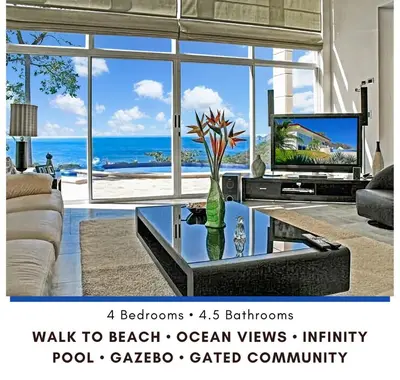 a living room with a view of the ocean at Modern 4 Bedroom Infinity Pool Beach, Sunset, in Playa Hermosa