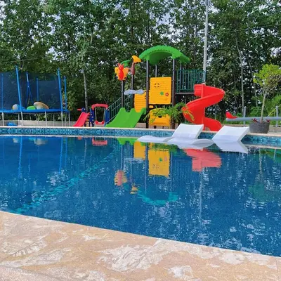 a playground with a pool of water at Casa Brisa house in the mountains 15 minutes from the beach in Nicoya