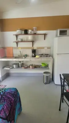 a kitchen with a counter with pots and pans at Residencial Oasis in Sámara