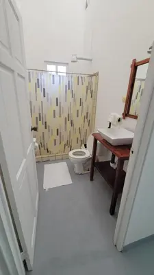 a bathroom with a toilet and a sink at Residencial Oasis in Sámara
