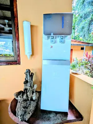 a white refrigerator in a room with a window at Lovely Tropical Ensuite Bedroom - Pool AC Hot Water in Herradura