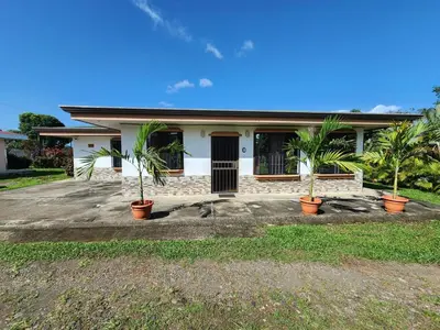 a house with two palm trees in front of it at La Fortuna, Fluca House 2 in Fortuna