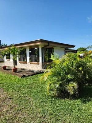 a house with palm trees in front of it at La Fortuna, Fluca House 2 in Fortuna