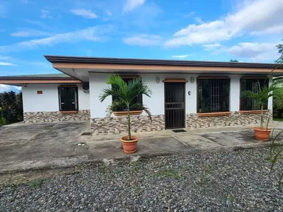 a house with two palm trees in front of it at La Fortuna, Fluca House 2 in Fortuna
