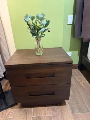 a vase of flowers on a dresser in a room at Penthouse San José Costa Rica in San José