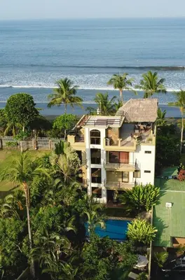 an aerial view of a resort with the ocean at Beachfront Terrace Sunset 3B in Jacó