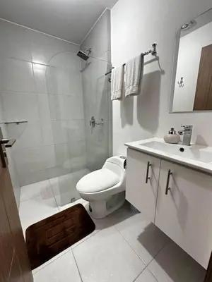 a bathroom with a toilet and a shower and a sink at Luxury 12th Floor Apartment with Views - Downtown San Jose Pool and Gym in San José