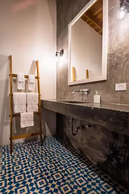 a bathroom with a sink and a mirror at The Sunset Shack in Nosara