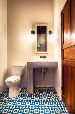 a bathroom with a toilet and a sink at The Sunset Shack in Nosara