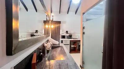 a kitchen with a large counter in a room at Ruta Verde BB in Tambor