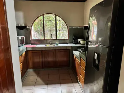 a kitchen with a sink and a window at Casa Mia playa Tambor in Tambor