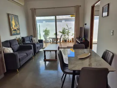 a living room with a couch and a table at CasaMar 2BD & 2BA in Jacó