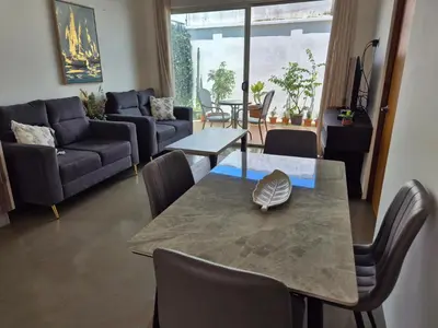 a living room with a table and a couch at CasaMar 2BD & 2BA in Jacó