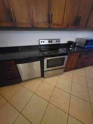a kitchen with a stove and a counter top at Hermosa Heights Villa 58 in Playa Hermosa