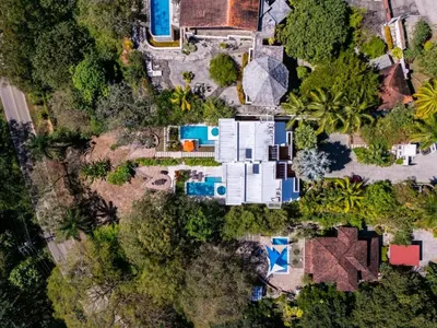 an overhead view of a house with a yard at Casa White Duplex Beautiful beach houses in Sámara
